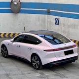 diamond pollen sparkling pink car wrap with gold flakes installed on a vehicle