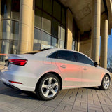 a small sedan with diamond pollen sparkling pink wrap installed