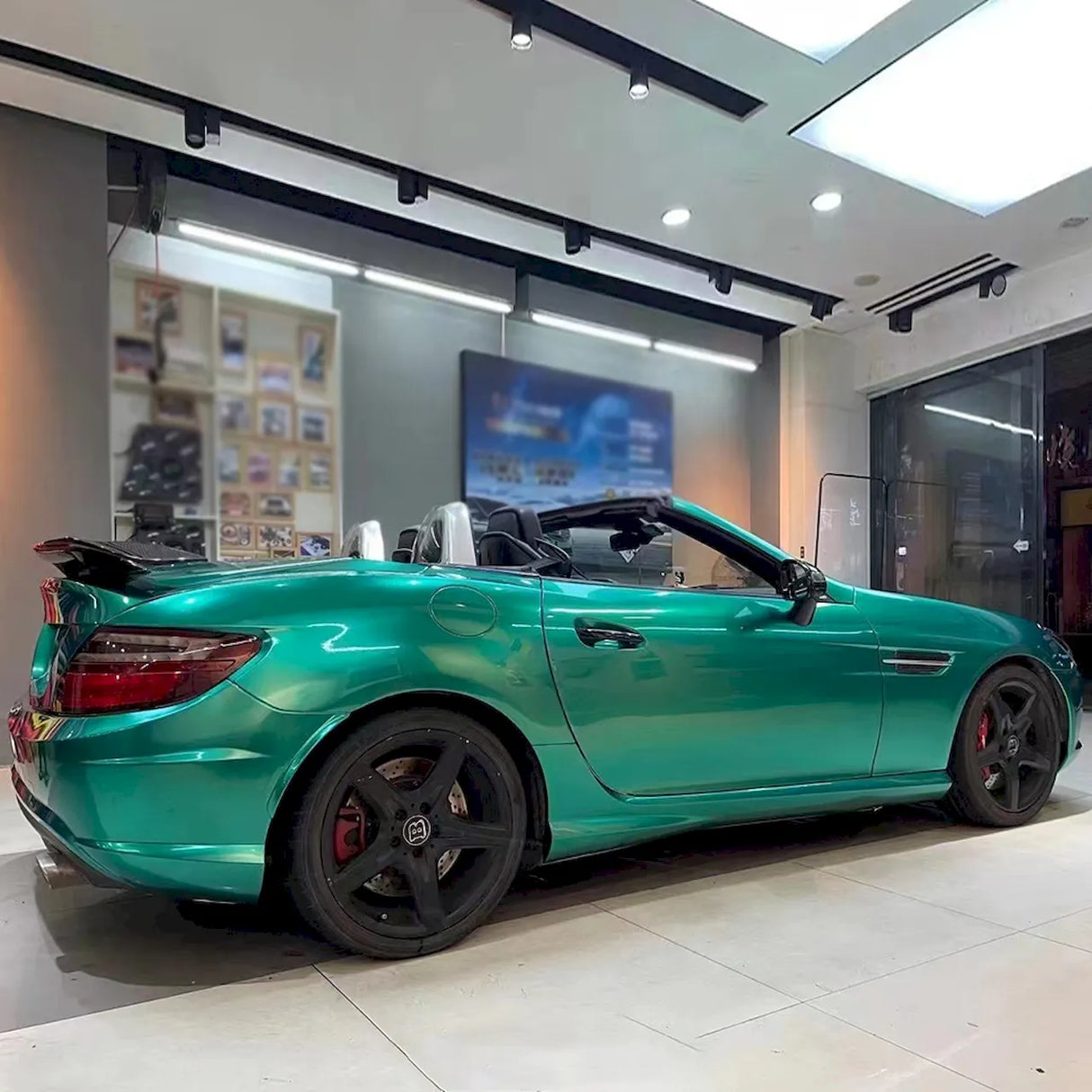 emerald green vinyl wrap installed on a convertible