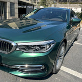 up close look at a car wrapped in emerald green car wrap