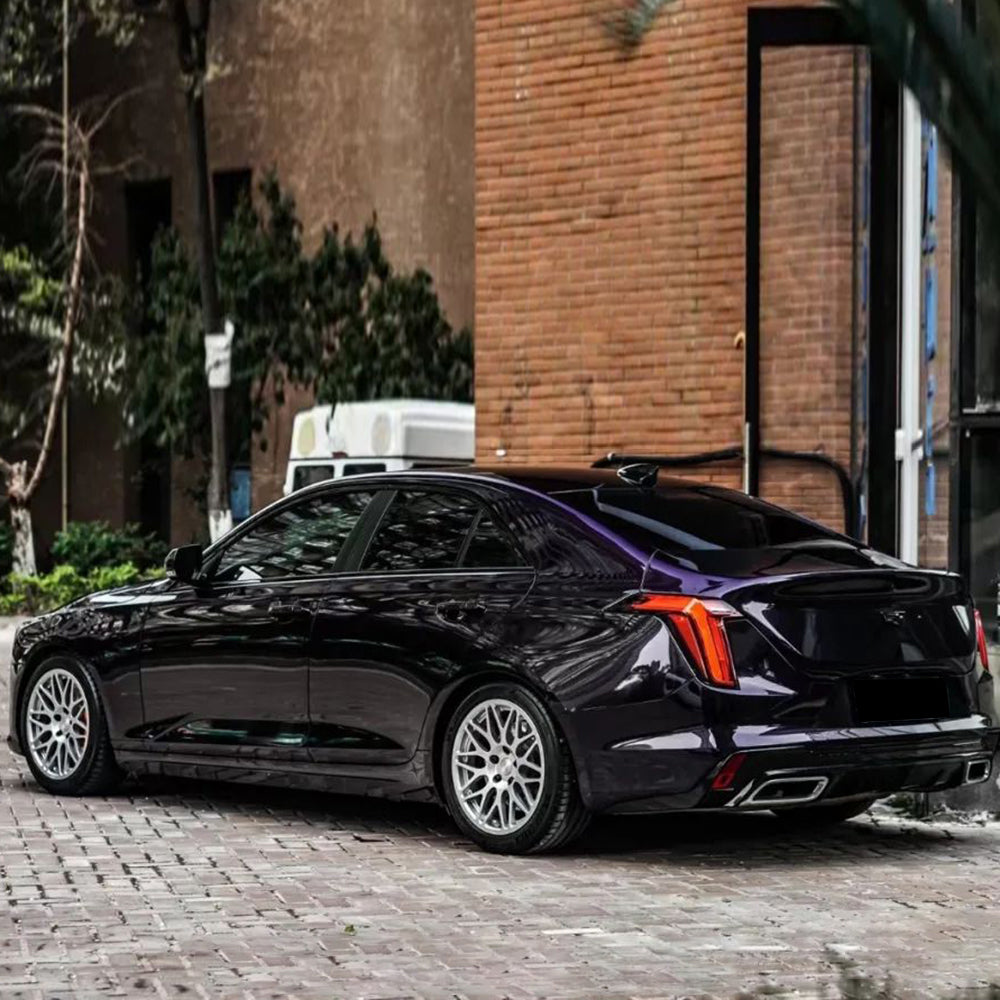 ghost midnight purple car wrap displayed on a cadillac