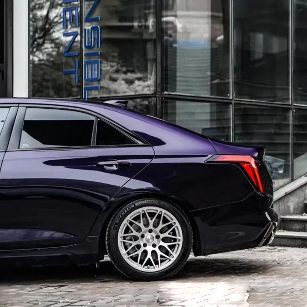 ghost midnight purple wrap on the back quarter panel of a car