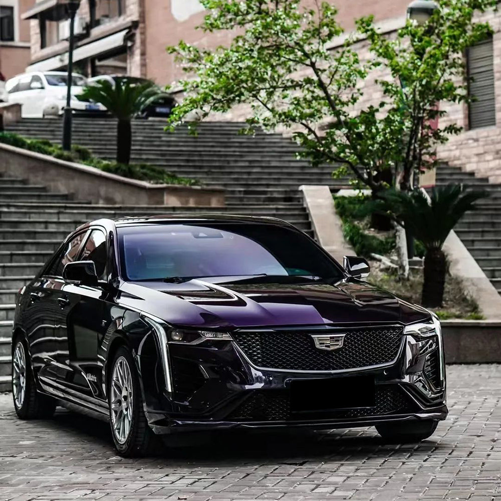 front view of a car wrapped in mods haus midnight purple wrap