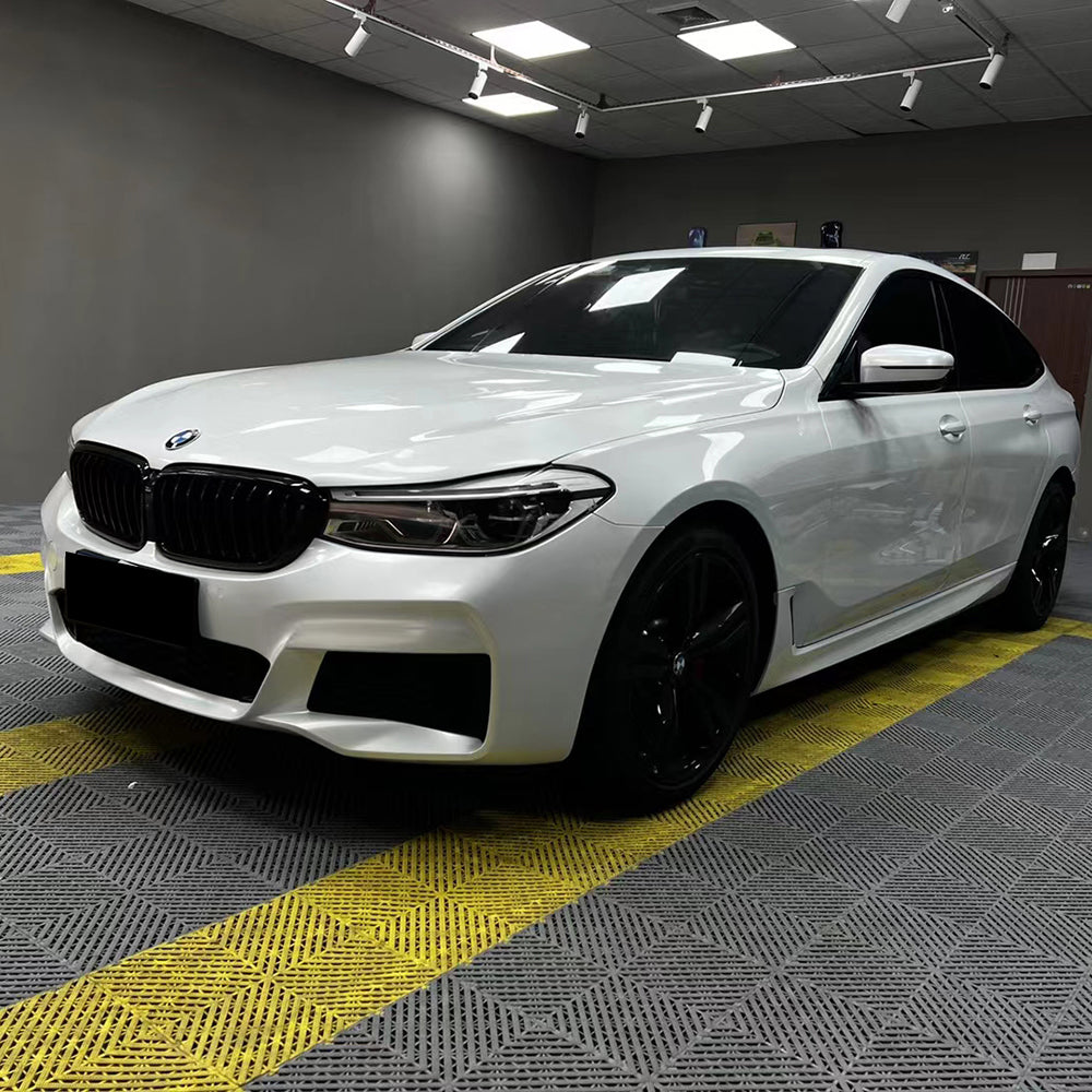 gloss crescent white car wrap on a car