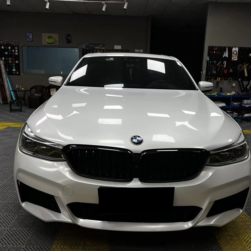 front shot of a car with gloss crescent white car wrap