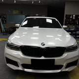 front shot of a car with gloss crescent white car wrap