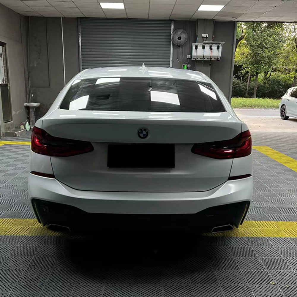 car being wrapped in gloss crescent white car wrap