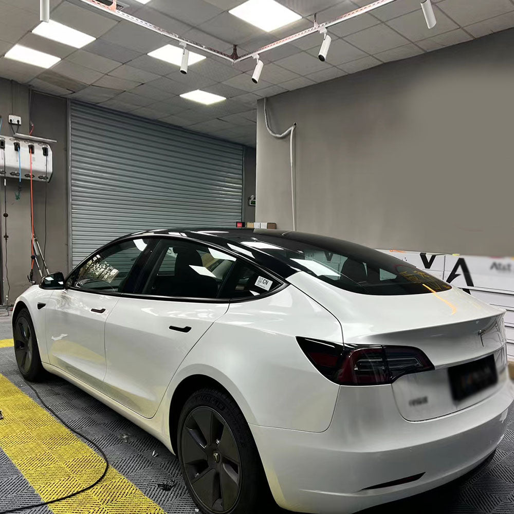 tesla getting wrapped in gloss crescent white car wrap