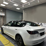 tesla getting wrapped in gloss crescent white car wrap