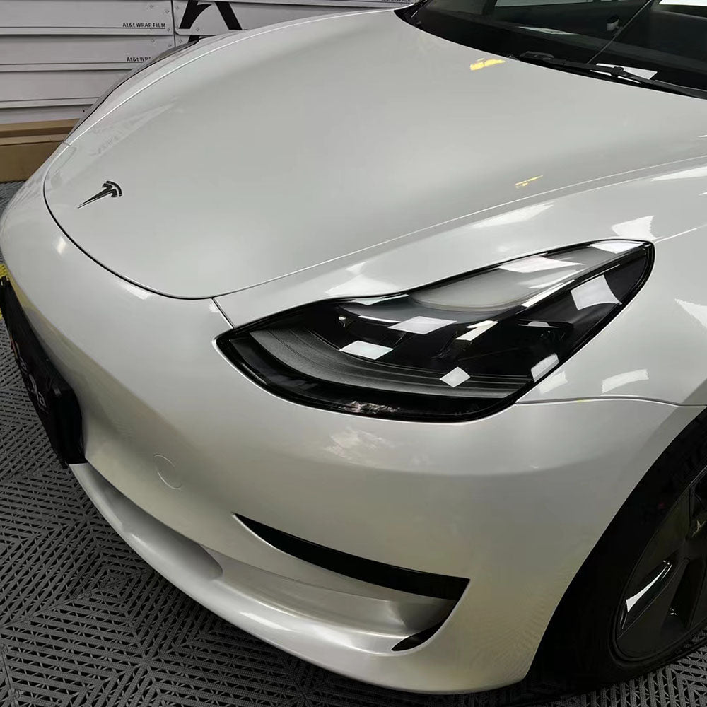 up close shot of gloss crescent white car wrap