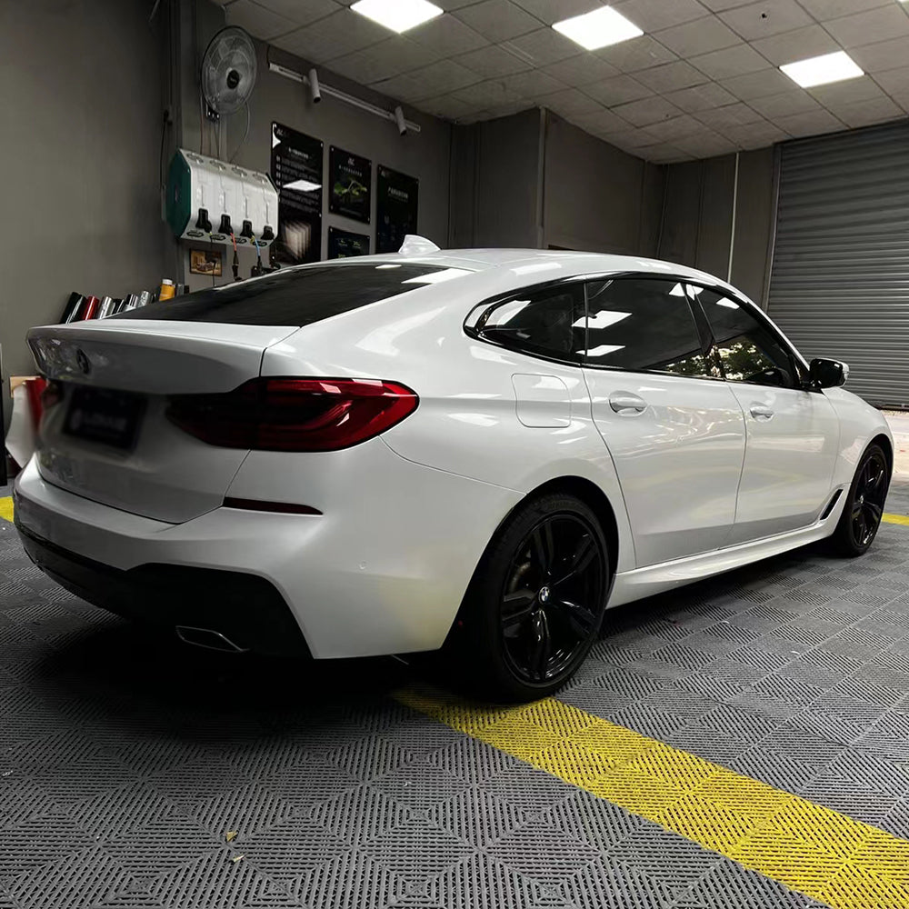 gloss crescent white car wrap on a sports car