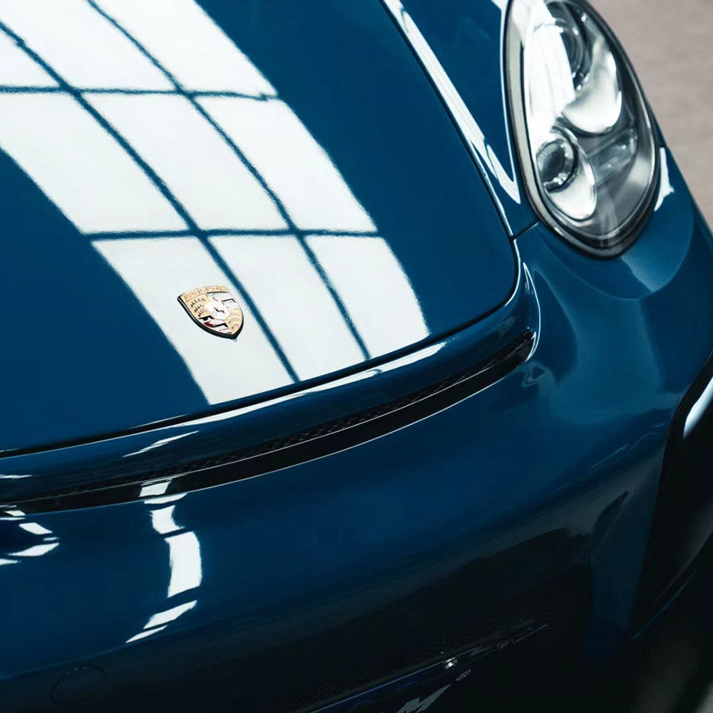 close up shot of gloss deep blue car wrap