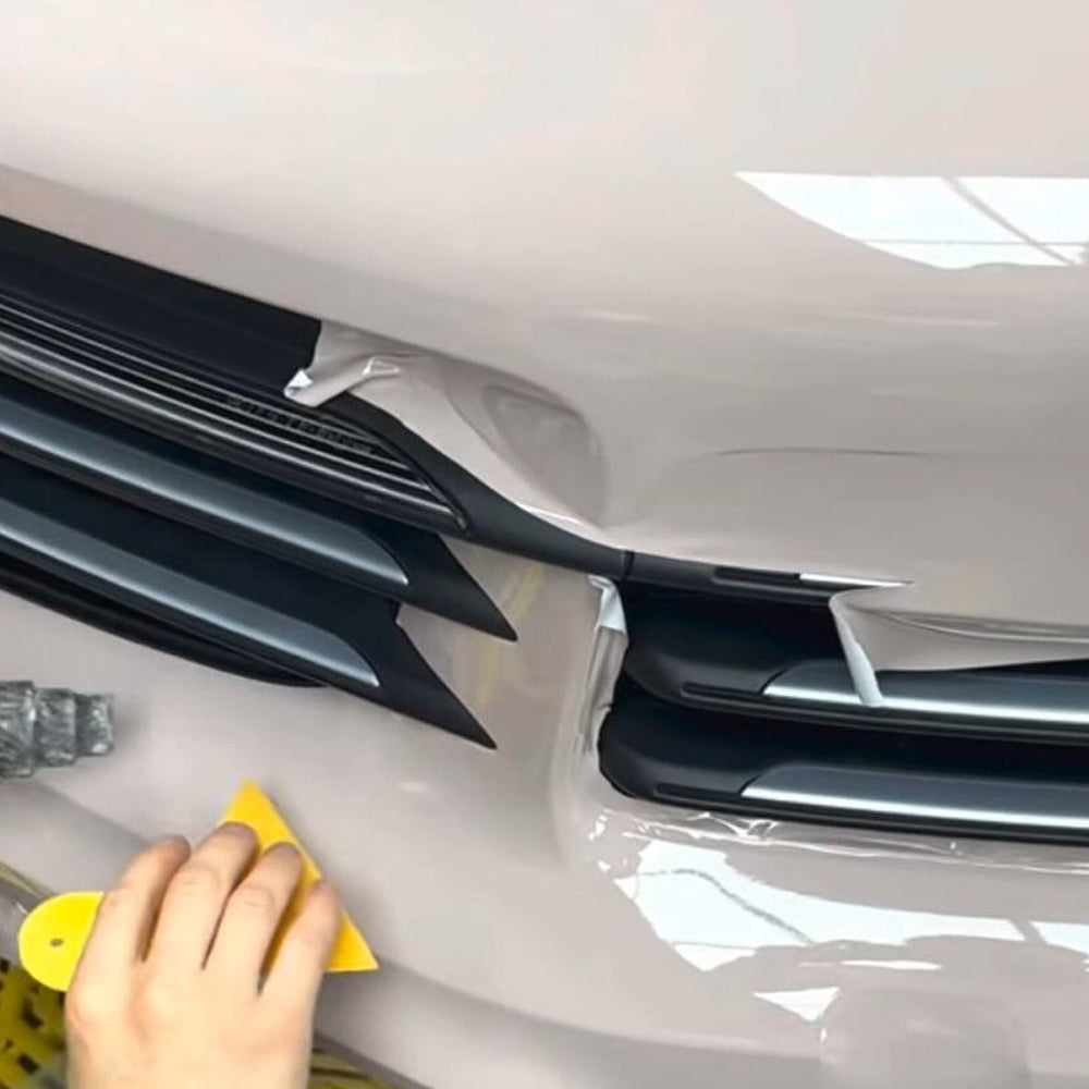 gloss first love pink car wrap being installed on a car