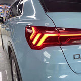 close up of gloss light blue car wrap