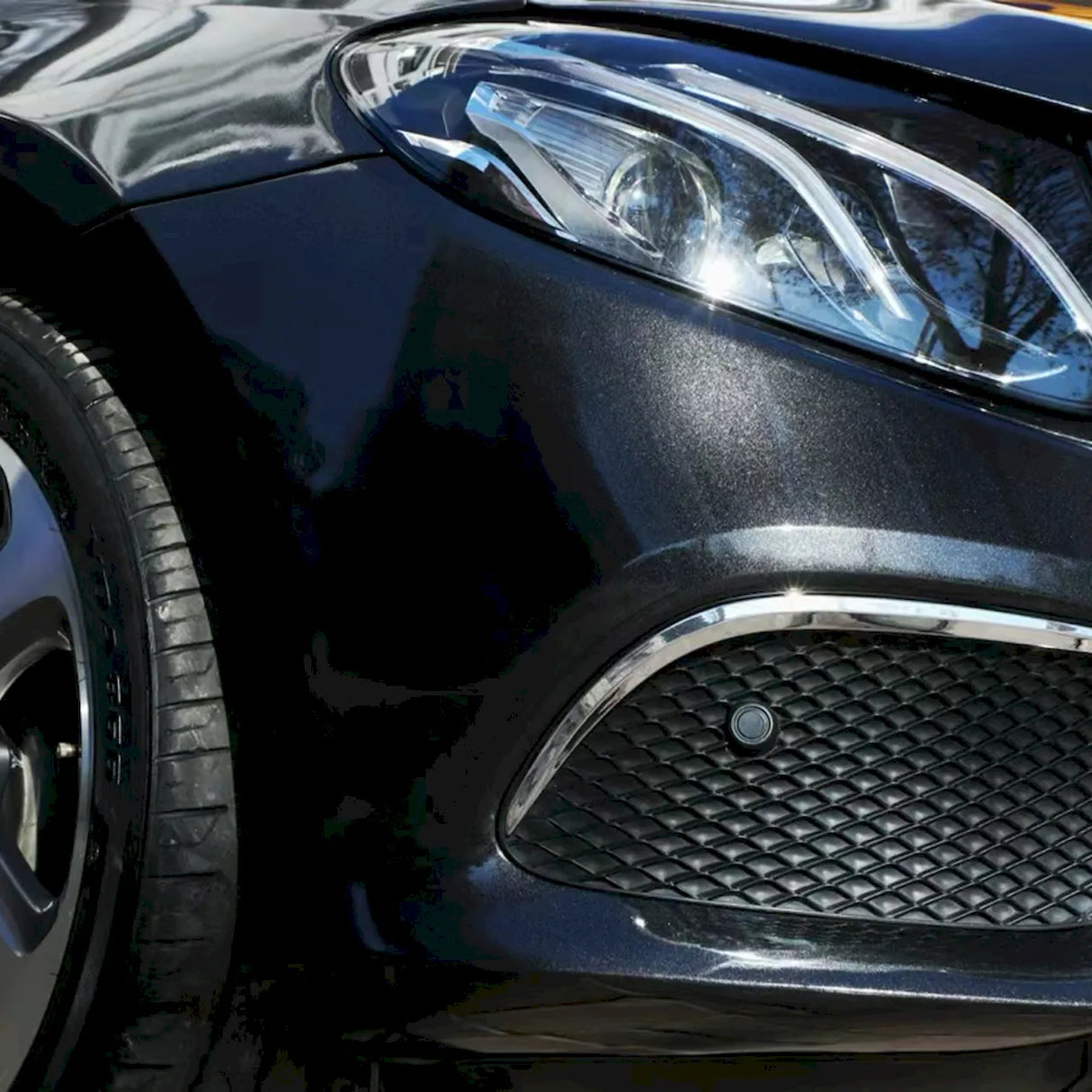 car wrapped in gloss metallic black vinyl