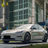 gloss metallic gray car wrap on a sedan