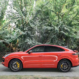 side profile of gloss redish orange car wrap