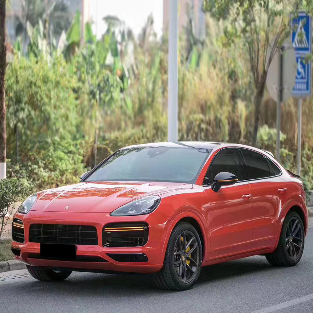 suv wrapped in gloss redish orange car wrap