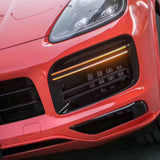 Front of a car wrapped in gloss redish orange car wrap