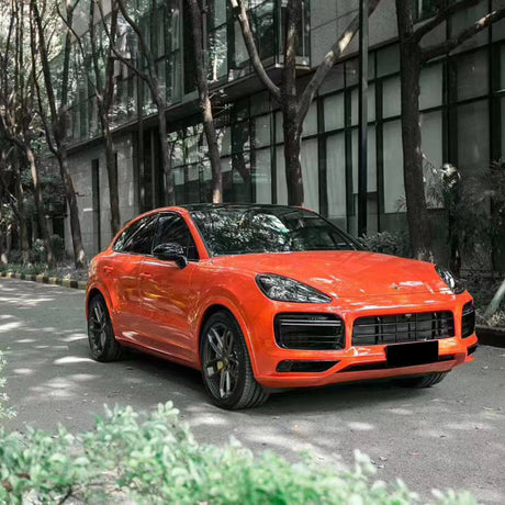 gloss redish orange car wrap on a car