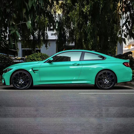 gloss retro green car wrap on a sports car