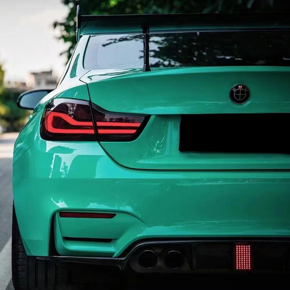 rear of a sports car wrapped in gloss retro green car wrap