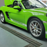 close up shot of a side of a car wrapped in gloss serpent green car wrap