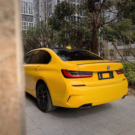 gloss sunflower yellow car wrap installed on a car