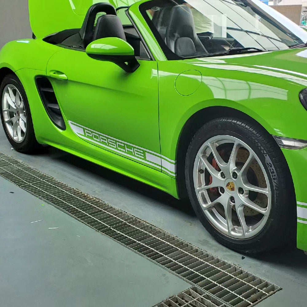 close up shot of a side of a car wrapped in gloss viper green car wrap