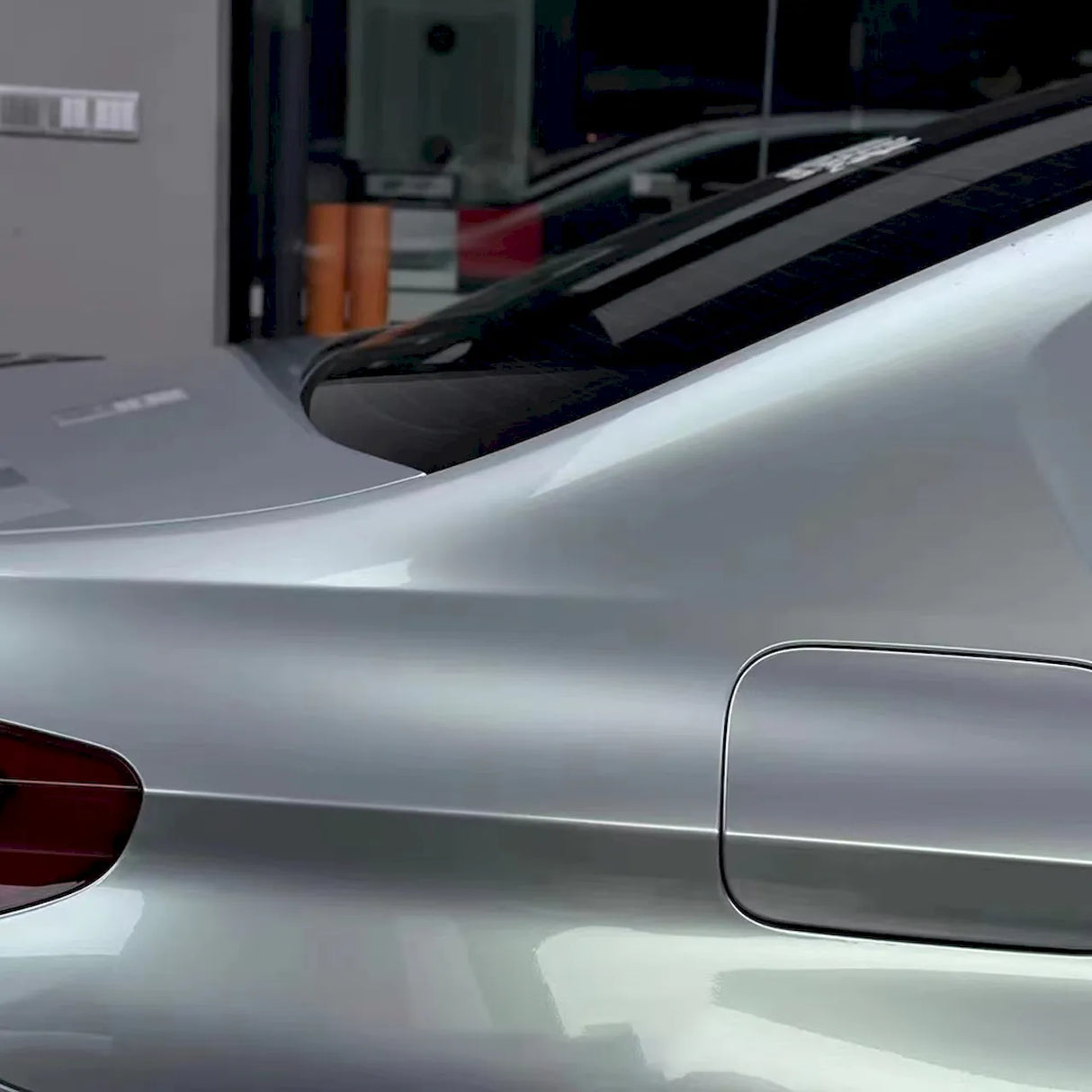 up close shot of a car wrapped in highland metallic green silver car wrap