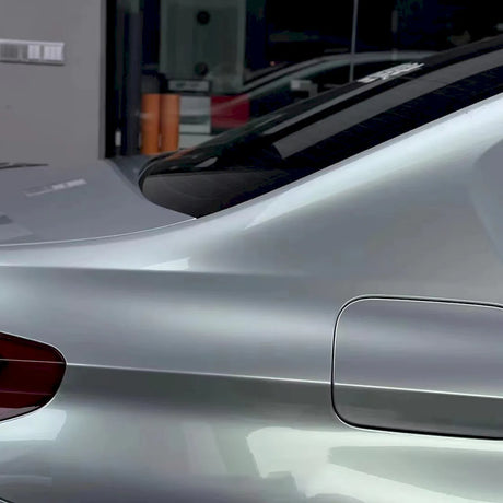 up close shot of a car wrapped in highland metallic green silver car wrap