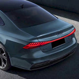 large sedan wrapped in hyper cyan blue car wrap