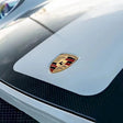 hood of a sports car wrapped in martin silver gray car wrap