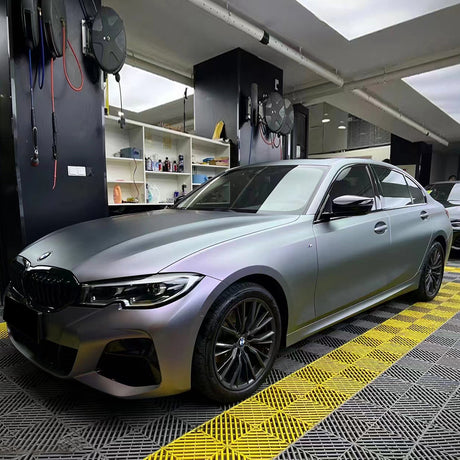 a car being wrapped in matte capri purple grey car wrap