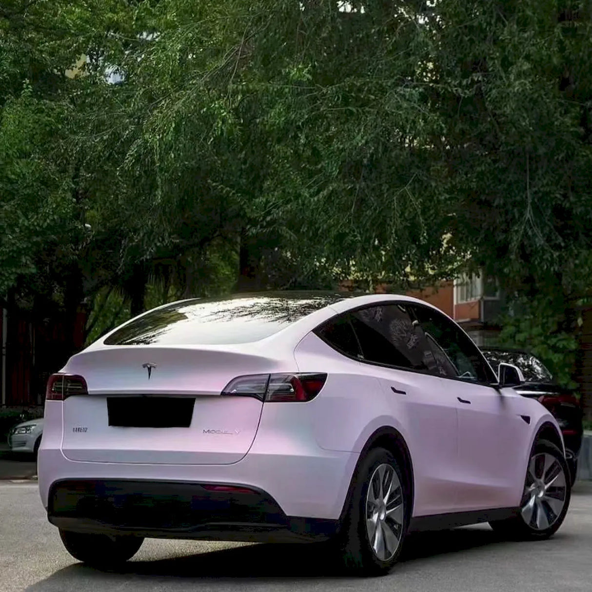 car with matte diamond pollen pink car wrap installed