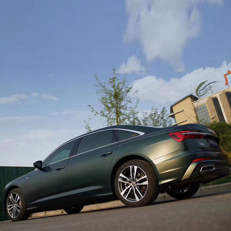 matte emerald green car wrap during sunset