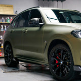 side shot of matte lightning green brown car wrap