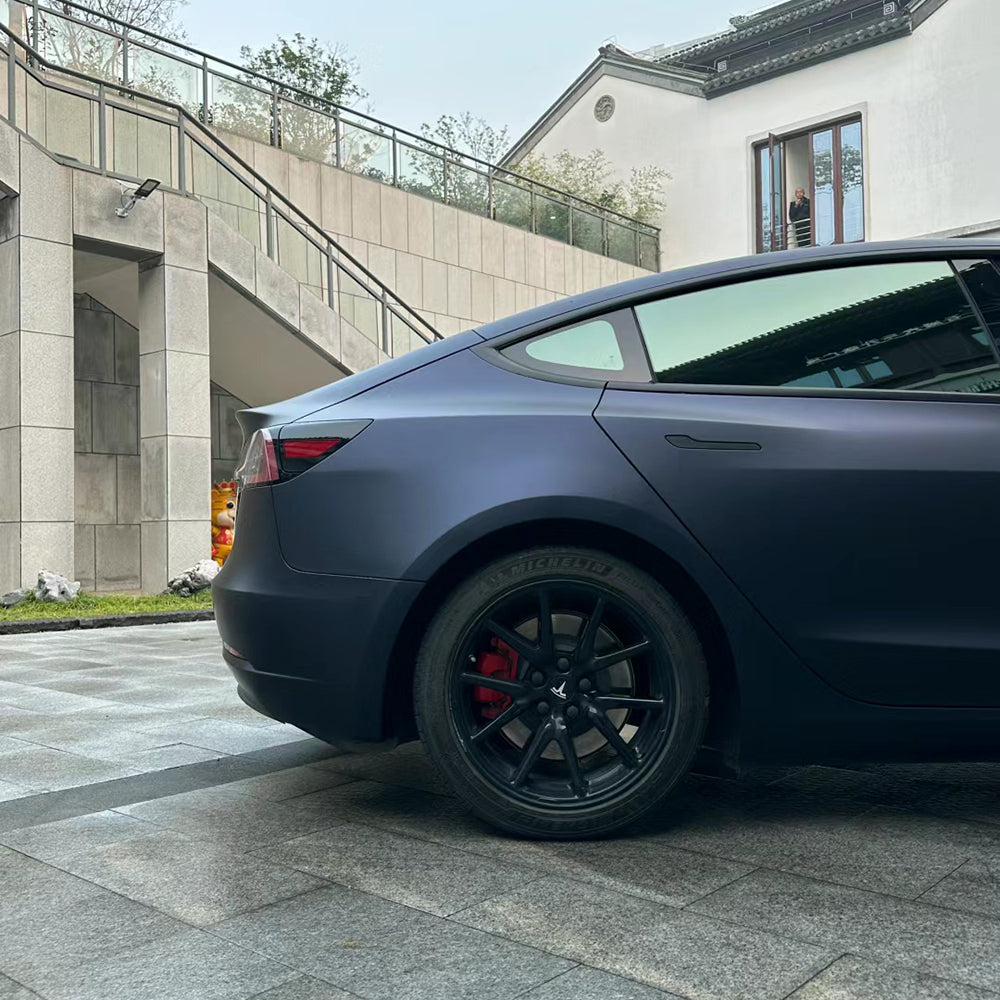 matte black blue car wrap on a car