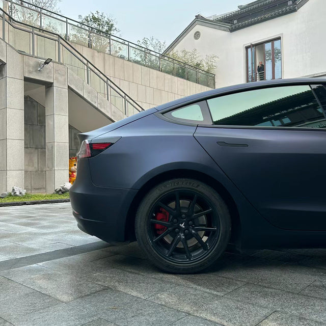 matte black blue car wrap on a car