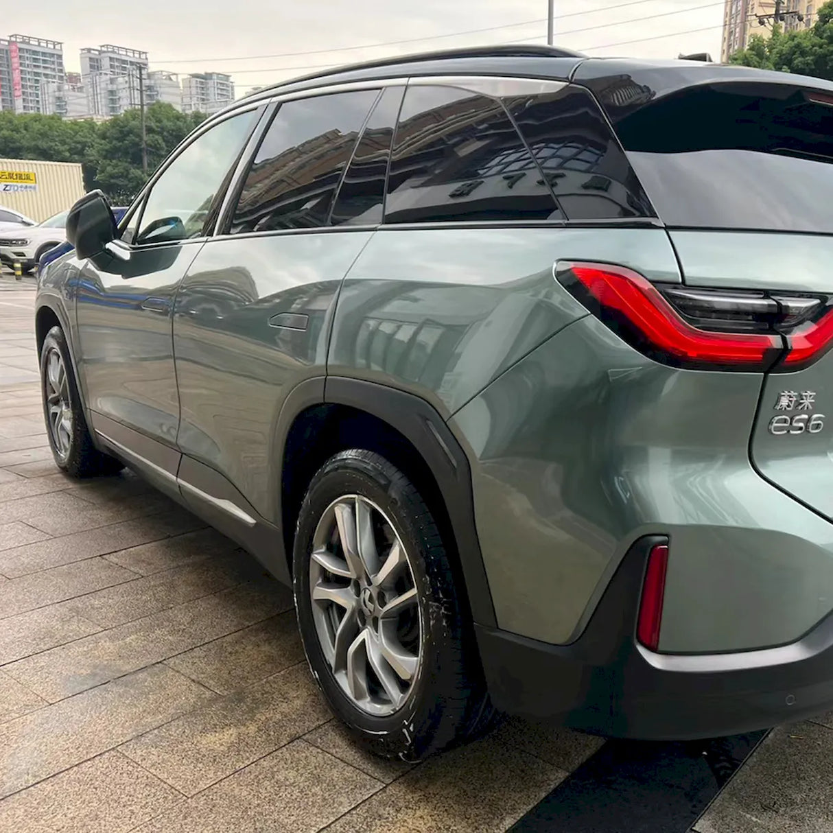 metallic aurora green car wrap installed on a suv