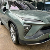 close up shot of metallic aurora green car vinyl wrap