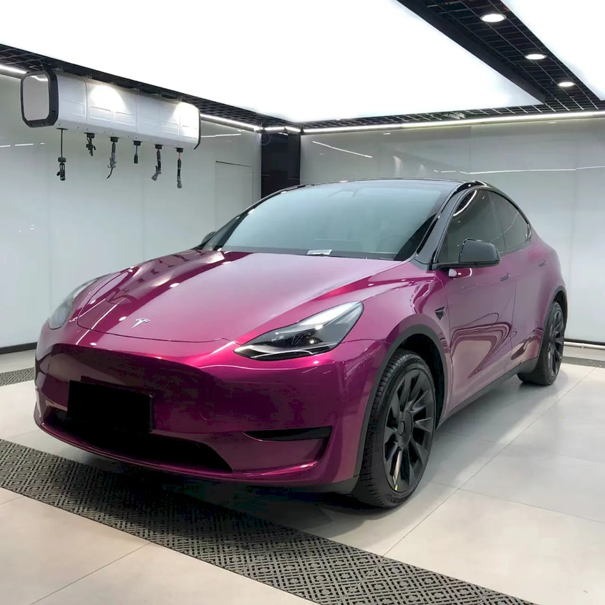 metallic berry purple car wrap installed on a vehicle