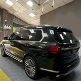 suv wrapped in metallic black gold vinyl wrap