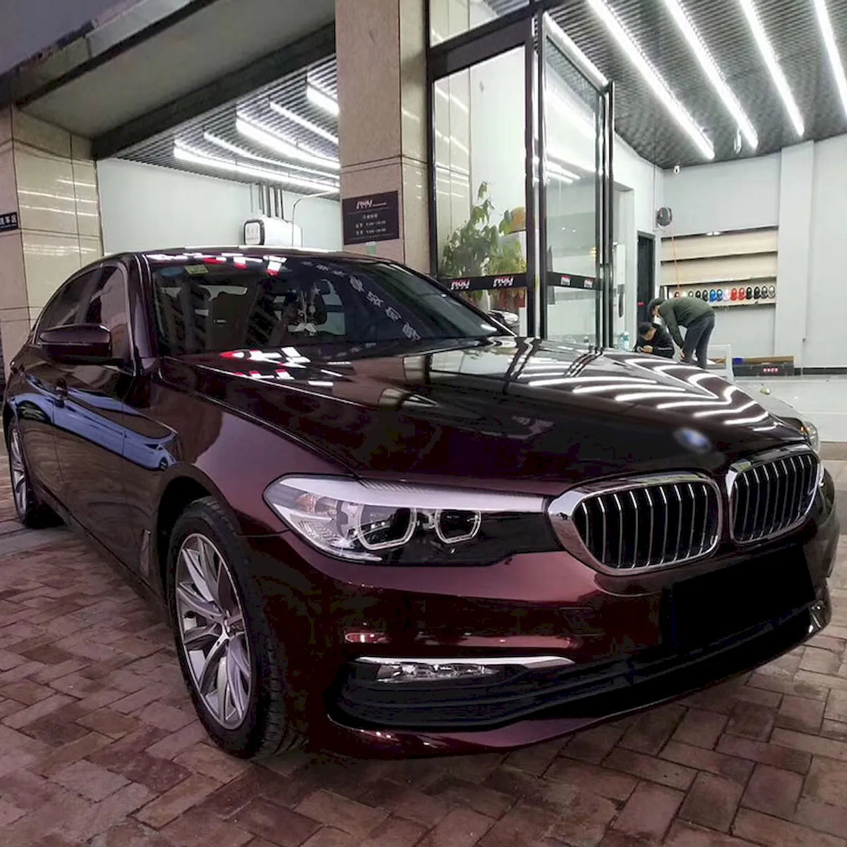 car wrapped with metallic black rose vehicle vinyl wrap