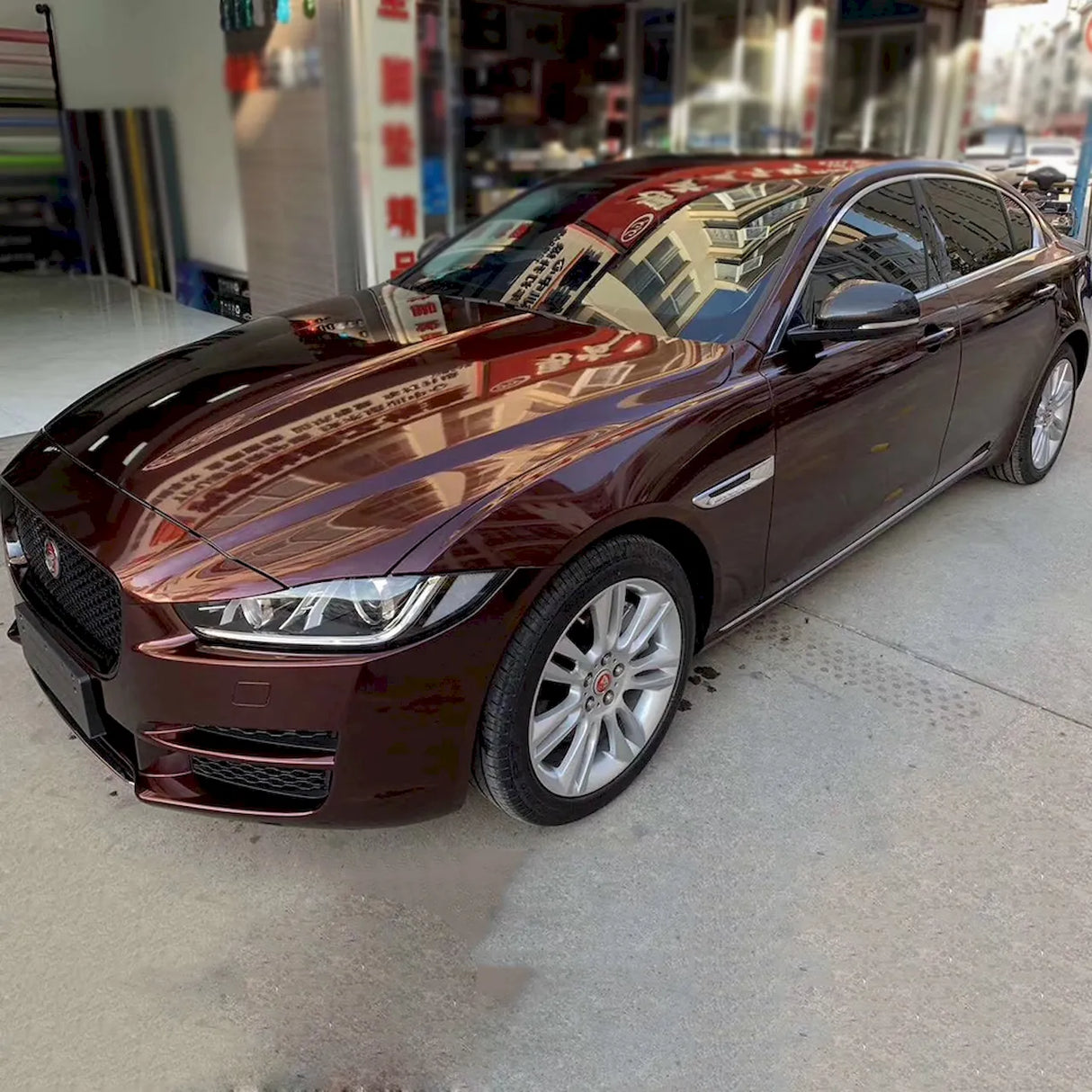 4 door vehicle wrapped in metallic black rose vinyl