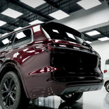 suv wrapped in metallic black rose vinyl wrap