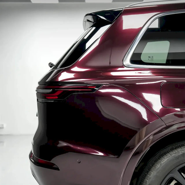 large suv wrapped in metallic black rose vinyl wrap