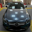 luxury car is being wrapped in metallic byron bay blue wrap