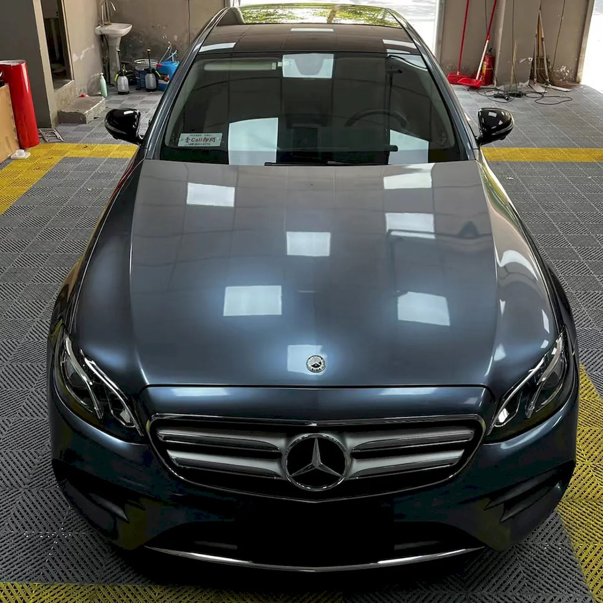 luxury car is being wrapped in metallic byron bay blue wrap