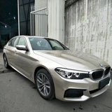 metallic champaign light gold vehicle vinyl wrap installed on a sedan